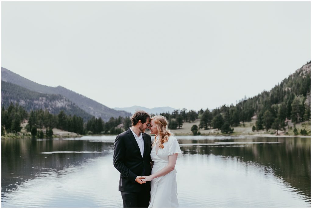 bride and groom at Lily Lake in Estes Park 